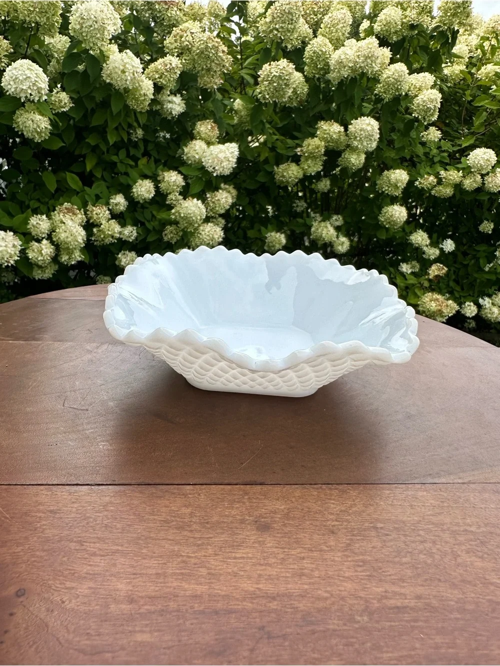 Milk glass dish in diamond pattern with scalloped edge